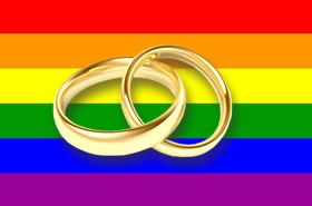 Bandiera dell'orgoglio LGBT con fedi nuziali