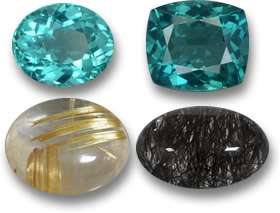 Gemme di apatite color verde acqua e cabochon di quarzo rutilo dorato e nero