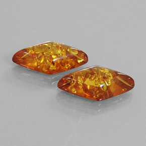 Ambra naturale arancione da  ct, forma fantasia, trasparente
