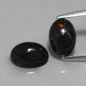 Opale nero naturale multicolore da  ct, taglio ovale, opaco