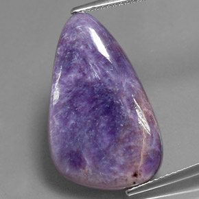Caroite viola naturale da 12,77 ct, forma fantasia, opaco