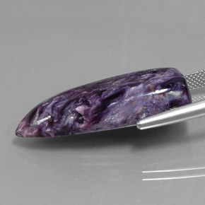 Caroite naturale viola da 27,21 ct, forma fantasia, opaco