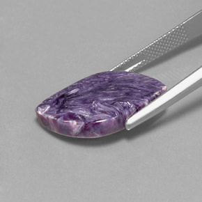 Caroite naturale viola da 9,50 ct, forma fantasia, opaco