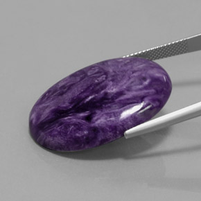 Caroite naturale viola da 27,90 ct, taglio ovale, opaco