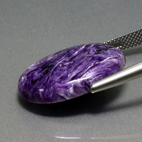 Caroite naturale viola da 13,86 ct, taglio ovale, opaco