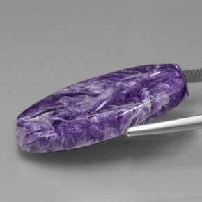 Caroite naturale viola da 31,84 ct, forma fantasia, opaco