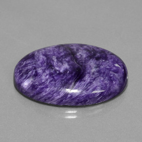 Caroite naturale viola da 29,80 ct, taglio ovale, opaco