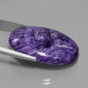 Caroite naturale viola da 29,80 ct, taglio ovale, opaco