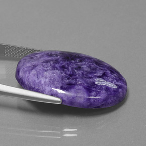 Caroite naturale viola da 27,61 ct, taglio ovale, opaco