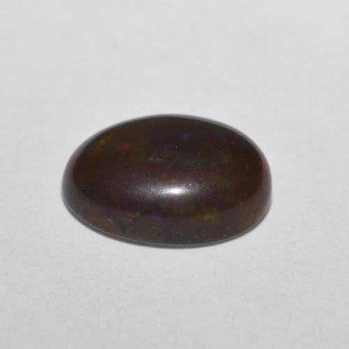 Opale cioccolato naturale multicolore da 0,52 ct, taglio ovale, traslucido