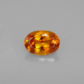 Clinoumite Giallo-arancione naturale da 0.48 ct, Taglio ovale, VS