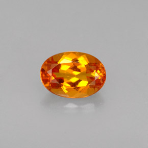 Clinoumite Giallo-arancione naturale da 0.56 ct, Taglio ovale, VS