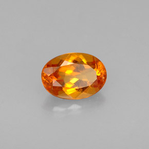 Clinoumite Giallo-arancione naturale da 0.56 ct, Taglio ovale, VS