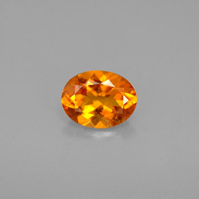 Clinoumite Giallo-arancione naturale da 0.60 ct, Taglio ovale, VS-SI