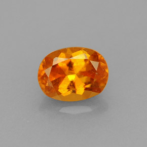 Clinoumite Giallo-arancione naturale da 0.75 ct, Taglio ovale, VS