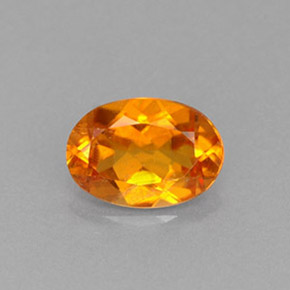Clinoumite Giallo-arancione naturale da 0.66 ct, Taglio ovale, VS-SI