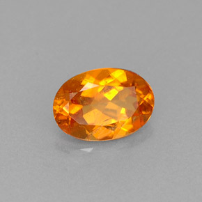 Clinoumite Giallo-arancione naturale da 0.66 ct, Taglio ovale, VS-SI