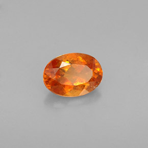 Clinoumite Giallo-arancione naturale da 0.64 ct, Taglio ovale, VS-SI