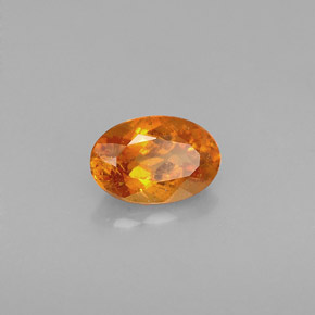 Clinoumite Giallo-arancione naturale da 0.64 ct, Taglio ovale, VS-SI