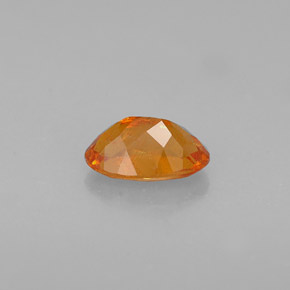 Clinoumite Giallo-arancione naturale da 0.64 ct, Taglio ovale, VS-SI