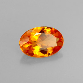 Clinohumite naturale arancione da 0,58 ct, taglio ovale, VS