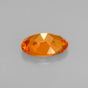 Clinohumite naturale arancione da 0,58 ct, taglio ovale, VS