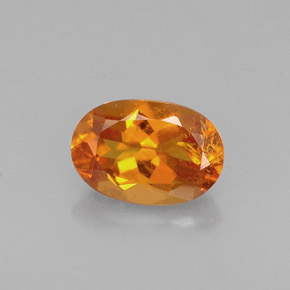 Clinoumite Giallo-arancione naturale da 0.60 ct, Taglio ovale, VS-SI