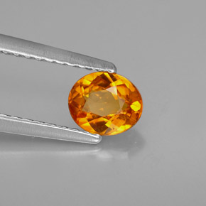 Clinoumite Giallo-arancione naturale da 0.54 ct, Taglio ovale, VS
