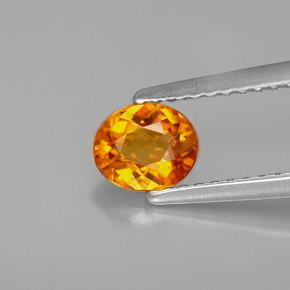 Clinoumite Giallo-arancione naturale da 0.54 ct, Taglio ovale, VS