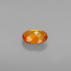 Clinoumite Giallo-arancione naturale da 0.54 ct, Taglio ovale, VS