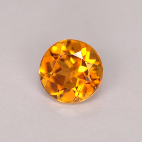Clinoumite Giallo-arancione naturale da 0.71 ct, Taglio rotondo, VS