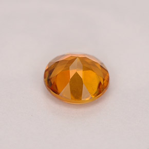 Clinoumite Giallo-arancione naturale da 0.71 ct, Taglio rotondo, VS