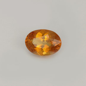 Clinoumite Giallo-arancione naturale da 0.77 ct, Taglio ovale, VS