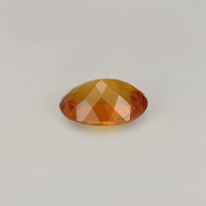 Clinoumite Giallo-arancione naturale da 0.77 ct, Taglio ovale, VS