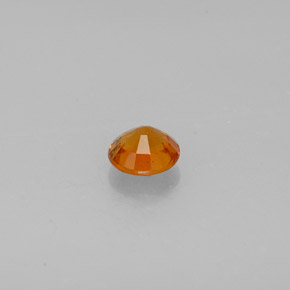 Clinoumite Giallo-arancione naturale da 0.64 ct, Taglio rotondo, SI