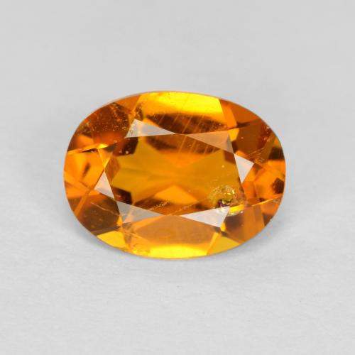 Clinoumite Arancione scuro naturale da 0.89 ct, Taglio ovale, SI