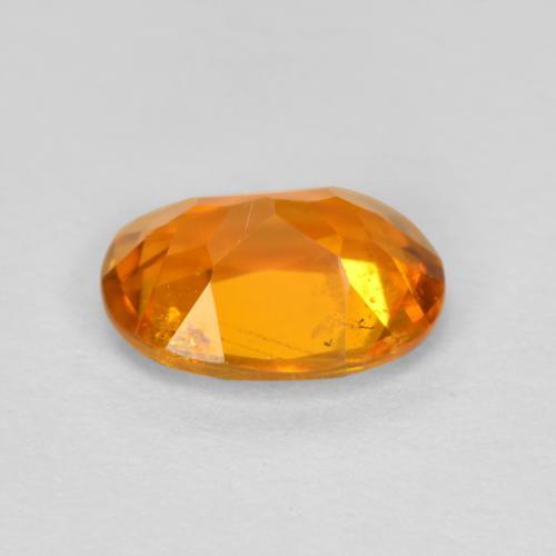Clinoumite Arancione scuro naturale da 0.89 ct, Taglio ovale, SI