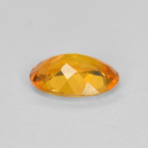 Clinoumite Albicocca Arancia naturale da 0.43 ct, Taglio ovale, SI