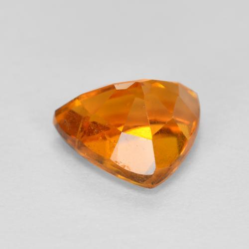 Clinohumite naturale arancione da 0,87 ct, trillion, SI