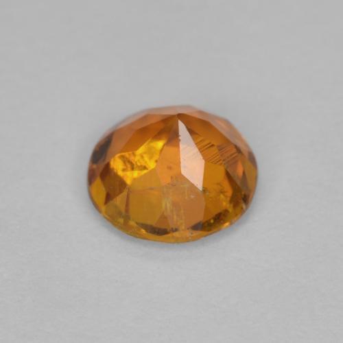 Clinohumite arancio medio naturale da 0,63 ct, taglio rotondo, SI