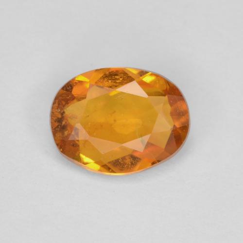 Clinoumite Marrone arancio naturale da 0.65 ct, Taglio ovale, SI