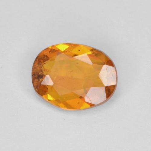 Clinoumite Marrone arancio naturale da 0.65 ct, Taglio ovale, SI