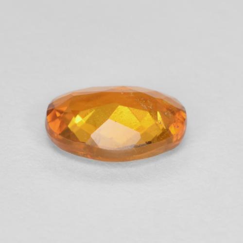 Clinoumite Marrone arancio naturale da 0.65 ct, Taglio ovale, SI