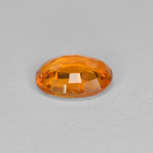 Clinoumite Arancio Medio naturale da 0.81 ct, Taglio ovale, VS-SI