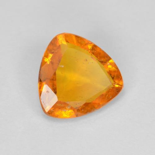 Clinoumite Arancione Ambra naturale da 0.83 ct, Taglio trillion, SI