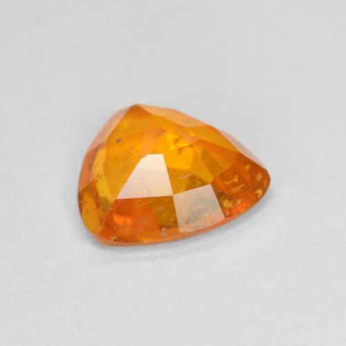 Clinoumite Arancione Ambra naturale da 0.83 ct, Taglio trillion, SI