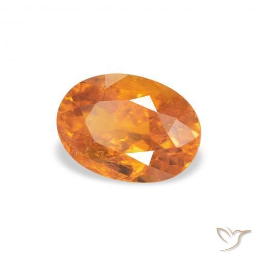 Clinoumite Arancione brillante naturale da 0.86 ct, Ovale, SI-I1