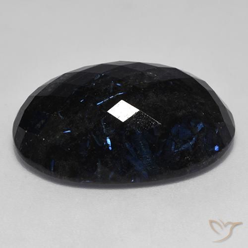 Nuummite Nero con scintillio blu naturale da 24.70 ct, Ovale, Opaco