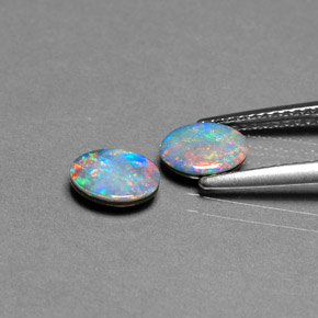 Doppietto di opale naturale multicolore da  ct, taglio ovale, opaco