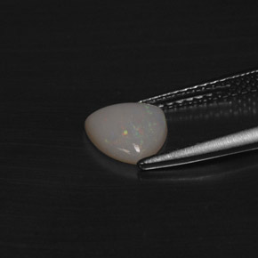 Opale naturale multicolore da 0,60 ct, trillion, traslucido